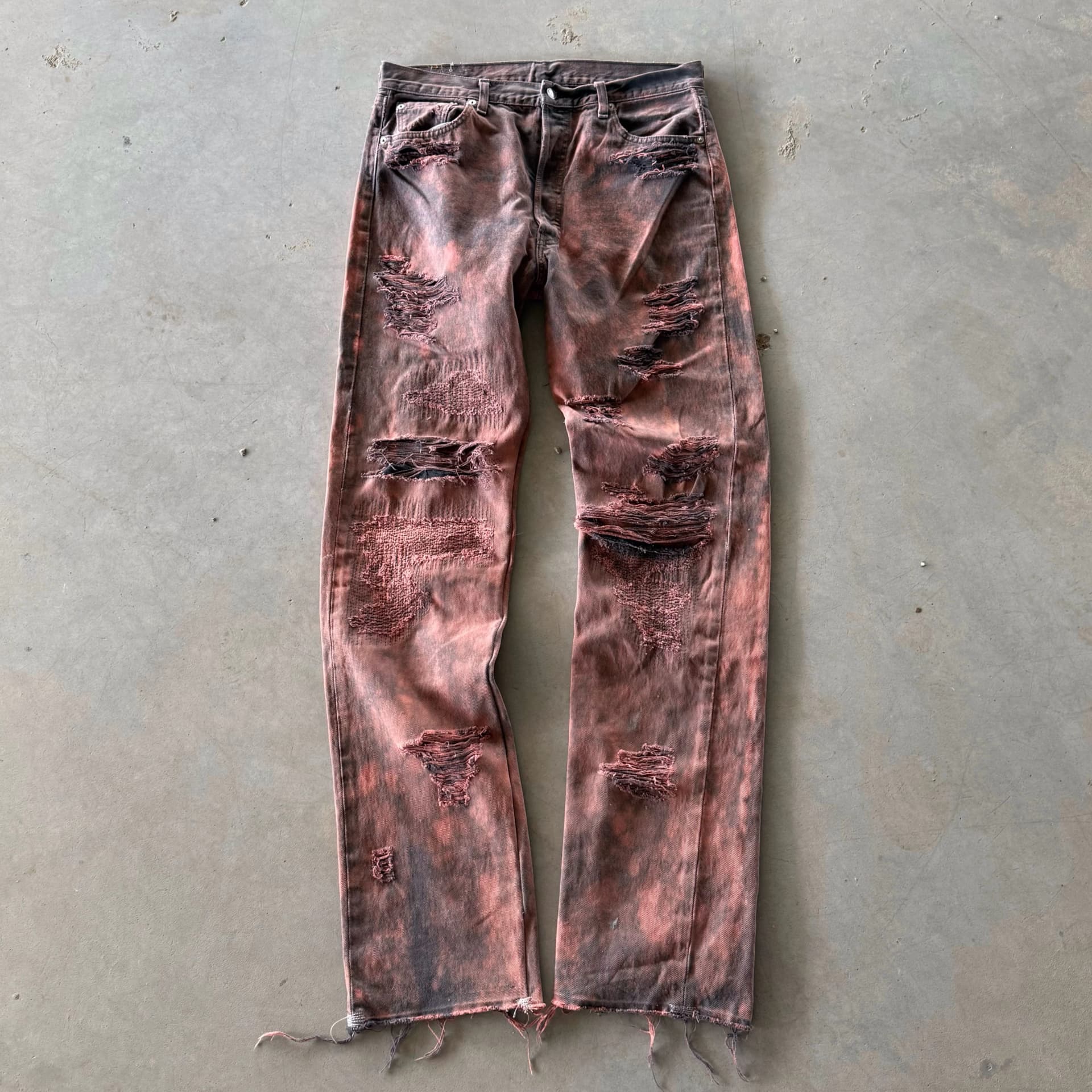 DISTRESSED AND REPAIRED PURPLE JEANS 