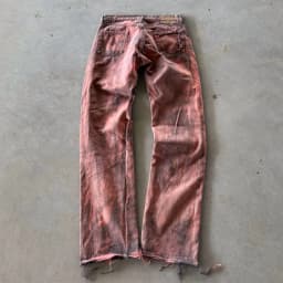 DISTRESSED AND REPAIRED PURPLE JEANS 