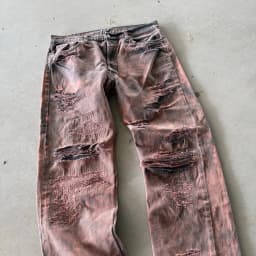 DISTRESSED AND REPAIRED PURPLE JEANS 