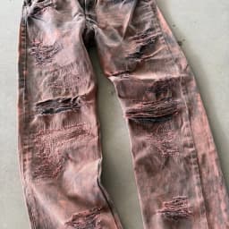 DISTRESSED AND REPAIRED PURPLE JEANS 