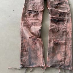 DISTRESSED AND REPAIRED PURPLE JEANS 